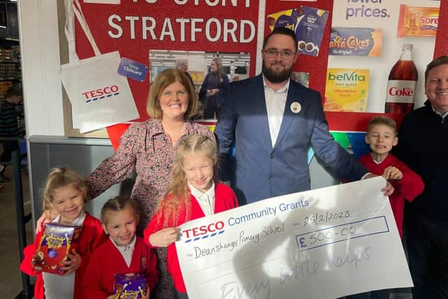 Youngsters at Deanshanger Primary School celebrate their cash gift