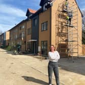 Cllr Emily Darlington outside the new houses