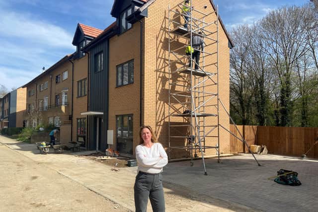 Cllr Emily Darlington outside the new houses