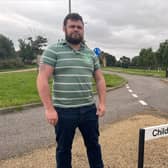 Tattenhoe ward councillor James Lancaster stands where the new grid road extension will be built to serve the proposed 1,200 home new Shenley Park development