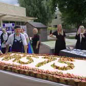 It took four people to carry the huge cake made by MK hospital