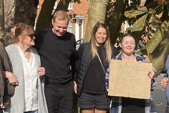 The protestors pictured after their victory in saving two mature trees from being chopped down in Newport Pagnell today