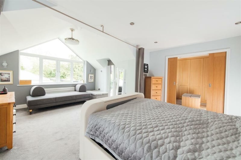 A large master suite comprises of a double bedroom which has been extended to the rear with a part vaulted high ceiling with feature glazing to the appex and French doors opening to a balcony