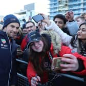 Sergio Perez poses for pictures with the fans at the MK Home Run