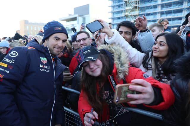 Sergio Perez poses for pictures with the fans at the MK Home Run