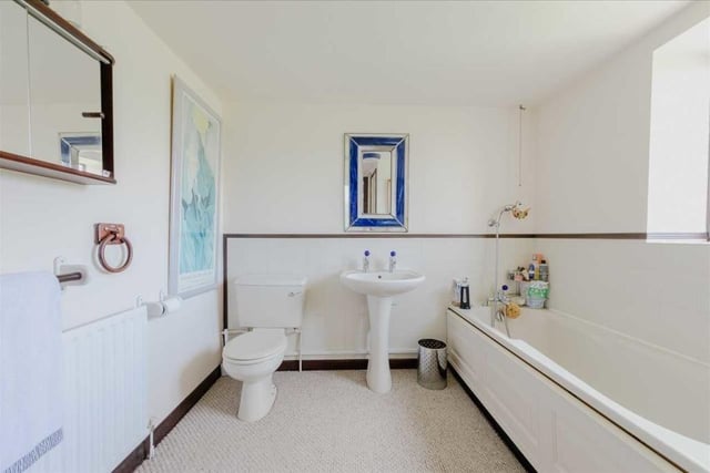 The property offers bedroom two with dressing area and en suite shower room in addition to a family bathroom