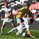 Louie Barry battles for the ball during his first start for the club