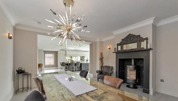 If you do not want to eat in the kitchen food can be served at this grand dining room which includes a toasty fireplace.