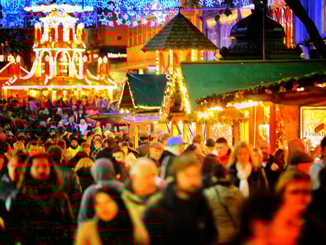 There's nothing warming yourself with a hot drink walking around Christmassy stalls on a wintery evening! Picture: Christopher Furlong/Getty Images