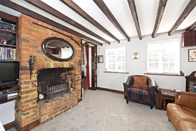 There's a large brick fireplace in the living room