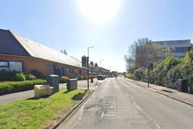 Three adults were injured after a blaze broke out in a three-storey block of flats in Newport Pagnell
