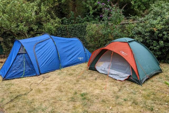 The tents that are currently home to landlord Alex and his son