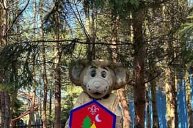 Gully Mouse holds the Beavers' badge at Gulliver's Land in Milton Keynes