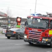 Three fire engines are in attendance.