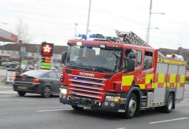 Three fire engines are in attendance.
