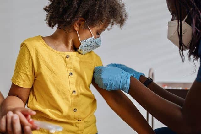 A child receives a vaccine