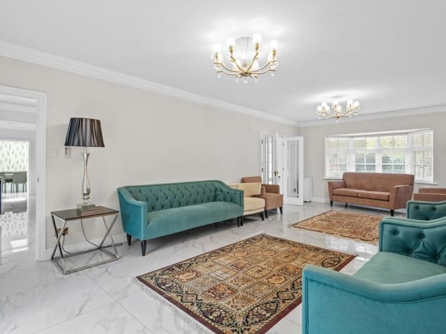 The ground floor includes a spacious sitting room, extending to almost 30 feet in length, with French doors which open on to the rear garden