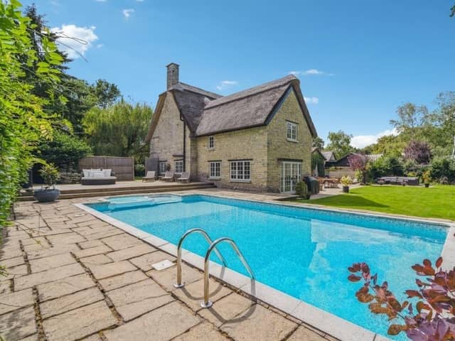 The property has been updated to feature a two-storey extension to create a home with both history and character, and give it a modern feel. Outside the driveway leads to a stone built garage feauring a gym and sauna area. The private rear garden has well tended grounds and features a heated swimming pool.