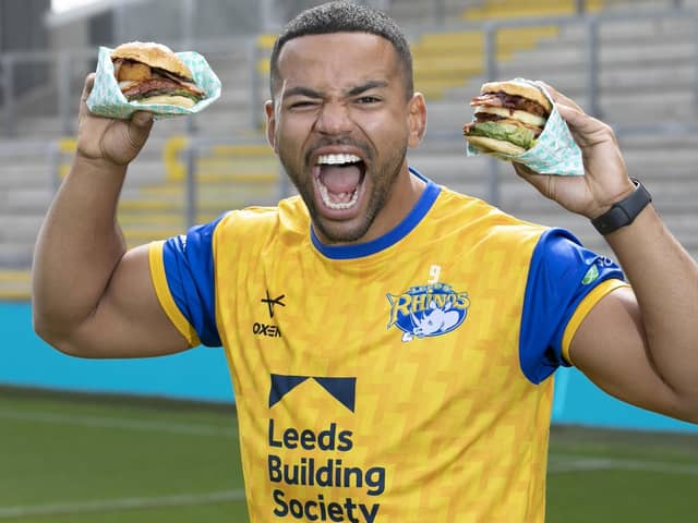 First men’s team captain of the Leeds Rhinos, Kruise Leeming, ‘try-s and tastes’ new Deliveroo x Hooyah Burgers exclusive Leeds Rhinos burger ahead of its launch on National Burger Day, August. 25 (photo: Doug Jackson/PinPep)