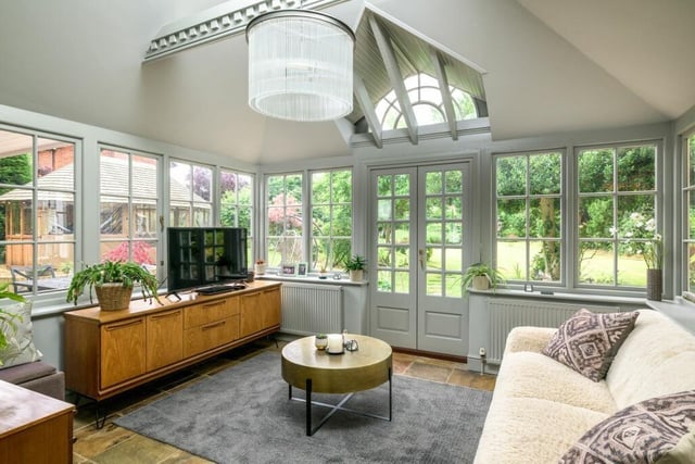 This light-filled sitting area is a joy with views across the landscape gardens