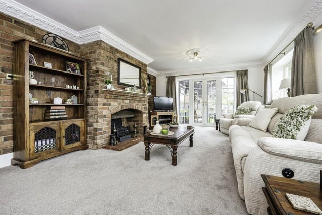 The main feature of this room is the brick feature wall, fireplace with mantel over and hearth, double glazed French doors to garden with double glazed windows either side, two double glazed window to side, further double glazed window, two radiators, feature coving to ceiling.