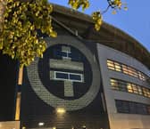 The distinctive Take That logo has appeared in lights on the wall of Stadium MK, dropping a strong hint that the band will perform there next year