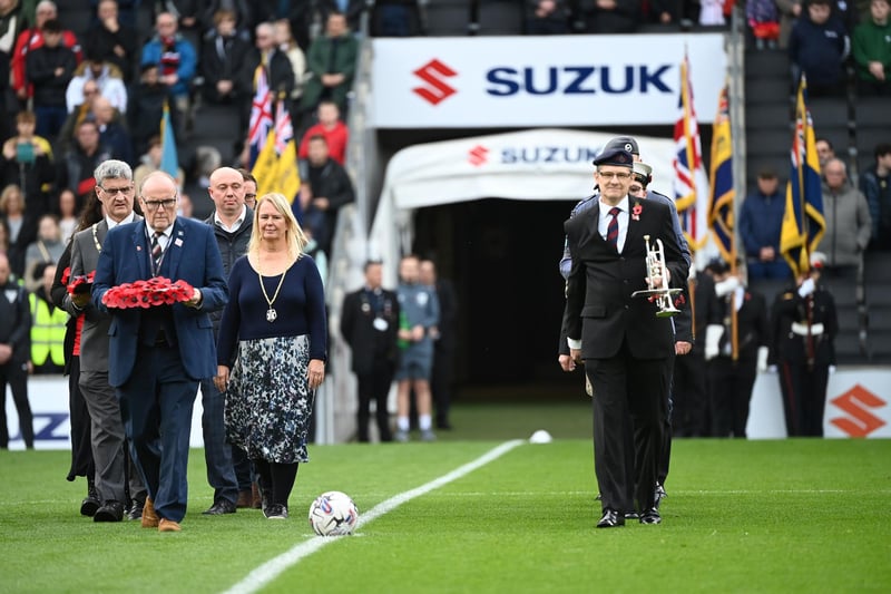 The dignitaries walking out onto the pitch ahead of the ceremony