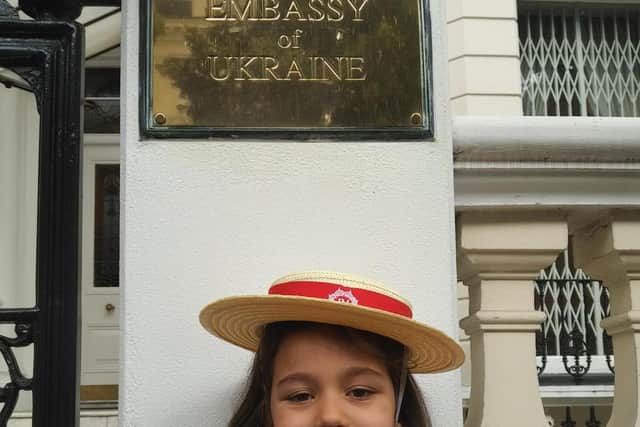 Madison outside the Ukrainian Embassy in London