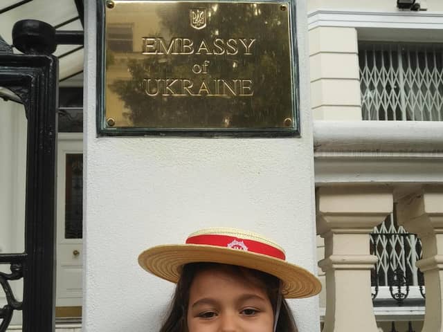 Madison outside the Ukrainian Embassy in London
