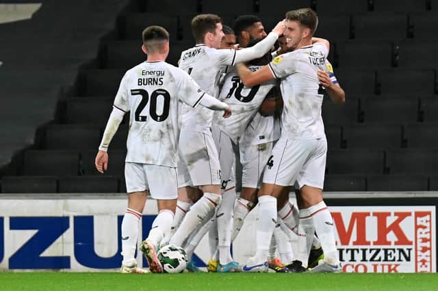 MK Dons made seven changes to the side to face Morecambe on Tuesday, but Liam Manning is likely to revert back to the side which has found form in the league against Derby