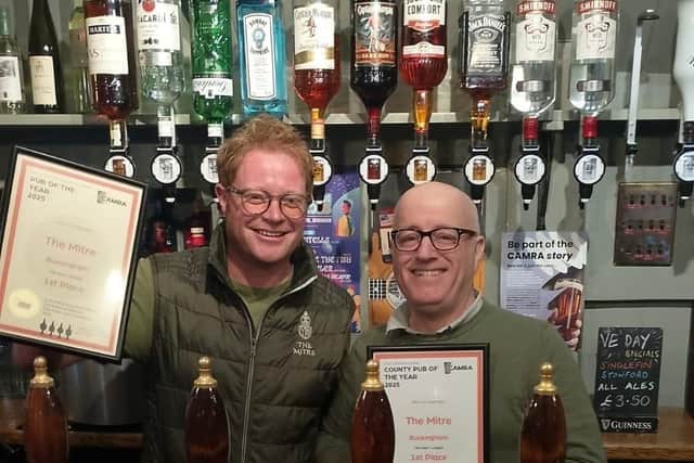 Pete Edwards (left) accepts his awards from David Martin