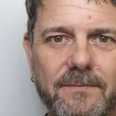 Simon Brown is wanted by Northamptonshire Police following a burglary in Towcester.