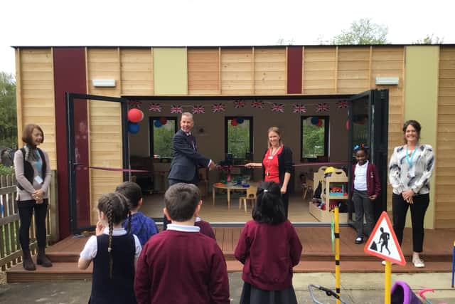 Mac Heath, Director of Children’s Services at Milton Keynes City Council, and Claire Wilson, headteacher at Wood End Infant and Pre-School, cutting the ribbon at Squirrels Children’s Centre