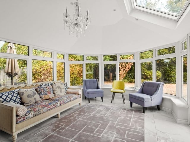 The conservatory sits at the rear of the property and provides views across the mature garden