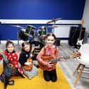 Children learning to play guitar during Learn to Play '22