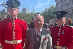 Roger before he went inside Buckingham Palace