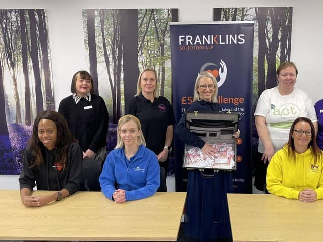 Andrea Smith, Partner at Franklins Solicitors, with representatives from each of the eight charities