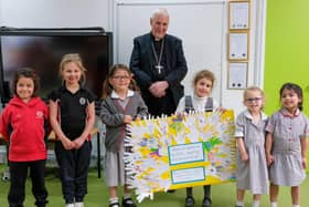 Reception and Year 1 children present their work to Bishop David