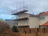 The house is surrounded by scaffolding