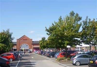 The distraction theft happened in the car park of Tesco at Wolverton in Milton Keynes