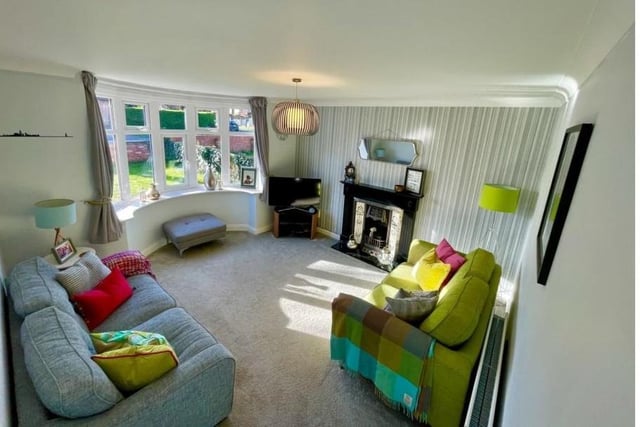 The spacious accommodation comprises elegant bay fronted lounge and feature fireplace