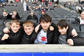 Fans watching the MK Dons game at home to Colchester United.