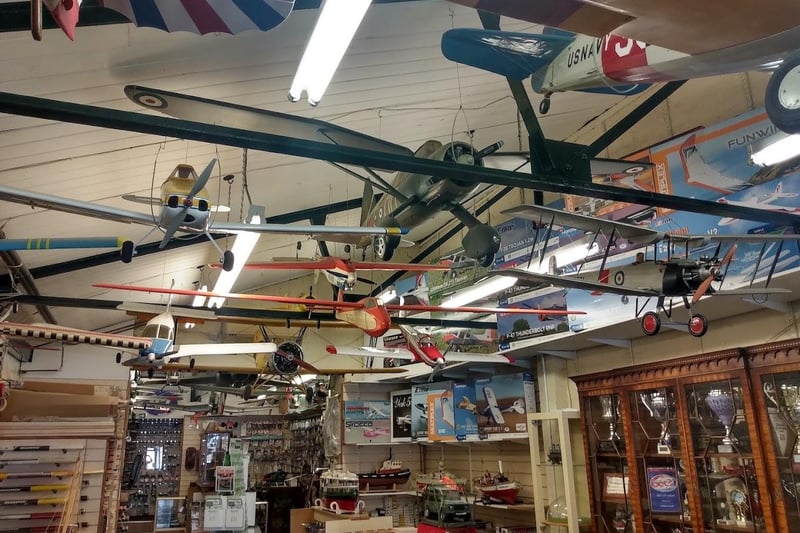 Model planes hang from the ceiling