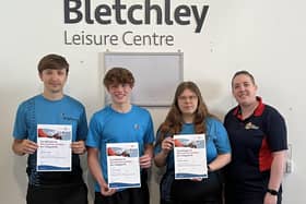 L-R Oliver, James and Oliwia receiving their award from RLSS Trainer Jess