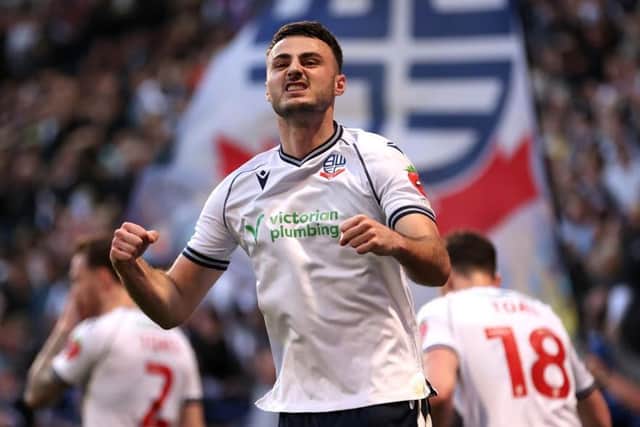 Bolton striker Aaron Collins has been linked with a move to MK Dons