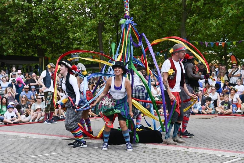 The dancers throw some Maypole into the mix.