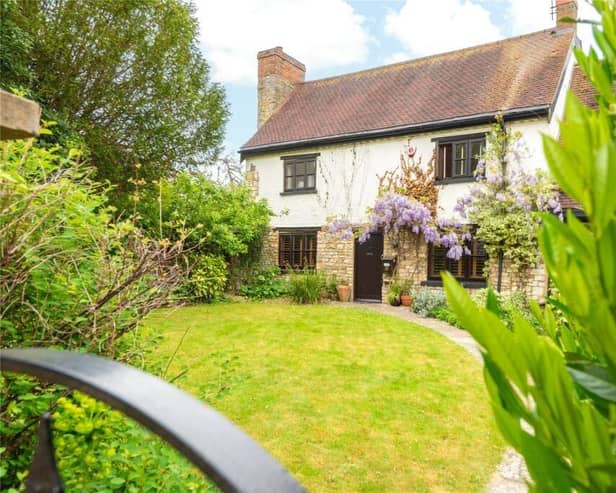 Talk about kerb appeal - the property picture postcard complete with an established wysteria framing the exterior