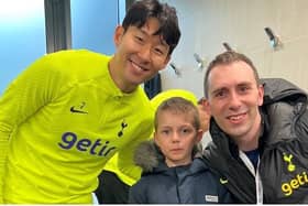 Young Alexander, pictured with dad Andrew, is a big Tottenham fan