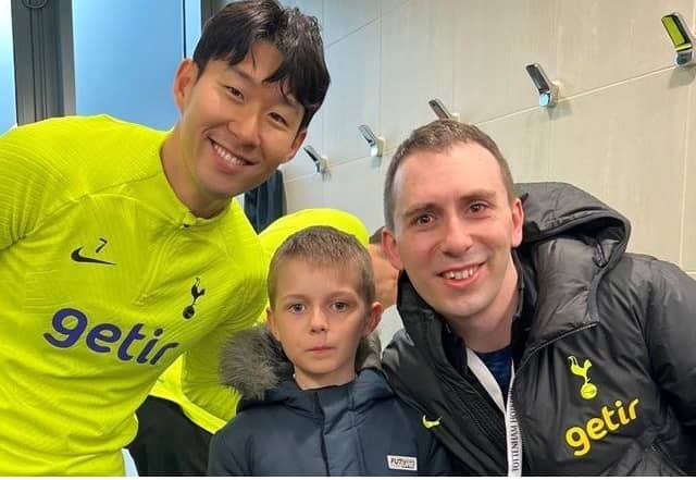 Young Alexander, pictured with dad Andrew, is a big Tottenham fan