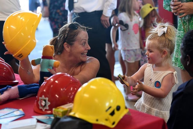 People could try on firefighters' hats